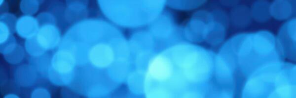 Beautiful blue bokeh background created by soft lights in an artistic abstract style for creative projects photo