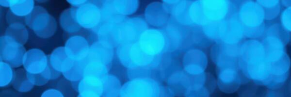 Captivating blue bokeh lights create a vibrant atmosphere for a lively celebration at night photo