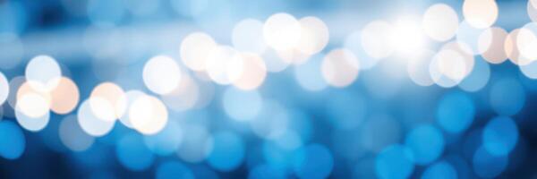 Beautiful blue bokeh lights twinkling softly in a nighttime urban setting during a festive gathering photo