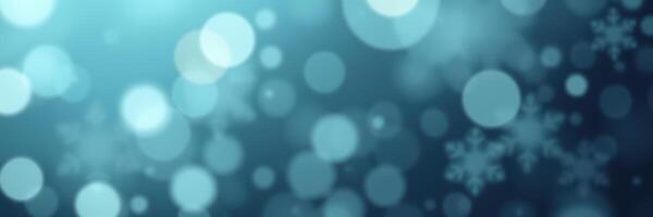 Soft blue bokeh background with delicate snowflakes creating a serene winter atmosphere photo