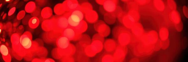 Vibrant red bokeh lights create a festive atmosphere during a winter celebration in the evening photo