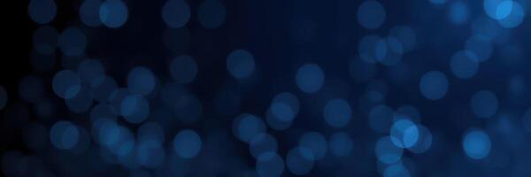 Beautiful blue bokeh lights create a dreamy atmosphere with soft reflections in the background during nighttime events photo