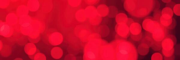 Vibrant red abstract background with blurred lights creating a festive atmosphere photo