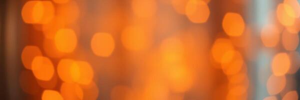 Warm orange bokeh lights create a cozy atmosphere in a festive setting during evening hours photo