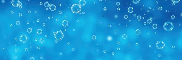 Bubbles rise gracefully in clear blue water, creating a serene underwater atmosphere during daylight hours photo