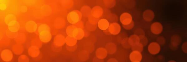 Warm and vibrant bokeh background created by shimmering lights in soft focus at night photo