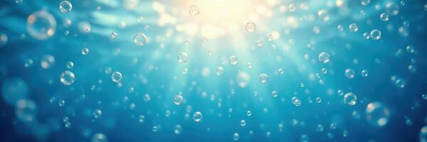 Sunlight filtering through water creating a serene underwater atmosphere with bubbles rising photo