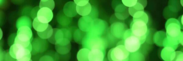 Green bokeh lights create a vibrant and festive atmosphere during a celebration or event at night photo