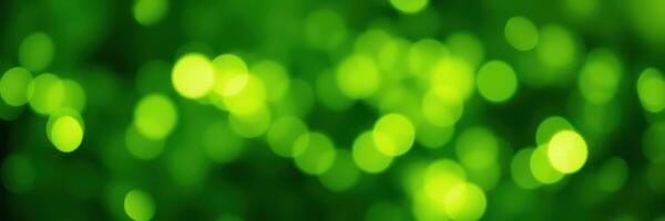 Shimmering green bokeh creates a vibrant backdrop for nature-inspired creativity and design photo