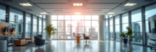 Bright modern office space with large windows overlooking a city skyline in the late afternoon light photo