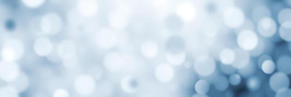 Soft blue bokeh lights create an ethereal atmosphere for a festive celebration or serene setting photo