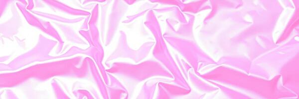 Wrinkled shiny pink fabric creating a soft and glossy texture under soft lighting in a playful arrangement photo