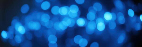 Soft blue bokeh lights create a calming atmosphere perfect for decoration or ambiance at evening events photo