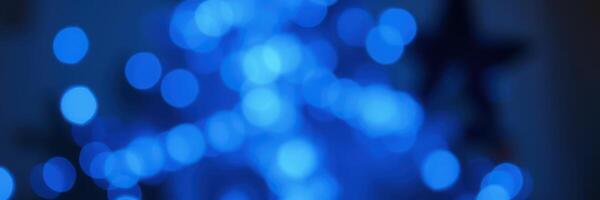 Soft blue bokeh lights create a calming atmosphere in a cozy indoor setting during the evening photo