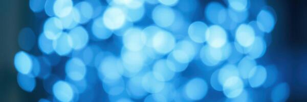 Glowing blue bokeh lights create a tranquil atmosphere for evening events and celebrations photo