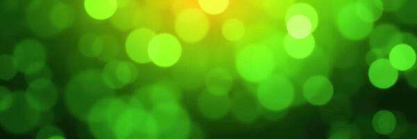 Beautiful green bokeh background reflecting light during a sunny day in nature photo