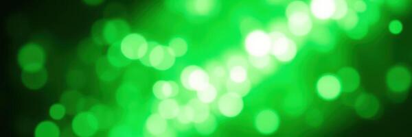 Lively green bokeh lights creating a festive atmosphere during an evening event or celebration photo