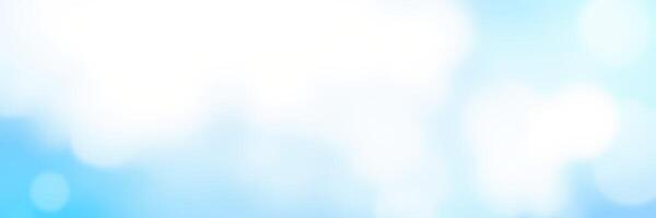 Cloudy blue sky with soft white clouds stretching across the horizon on a sunny day photo
