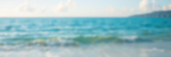 Waves gently roll onto a sunlit beach at midday, creating a tranquil and serene coastal atmosphere for relaxation photo