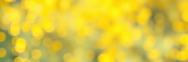 Vibrant yellow bokeh lights create a warm and inviting atmosphere during an outdoor gathering on a sunny day photo