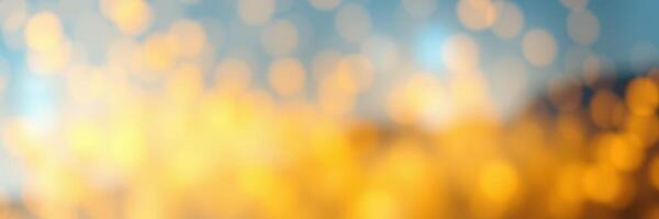 Vibrant bokeh effect creates a warm, blurred background with bright golden hues and a soft color gradient at sunset photo