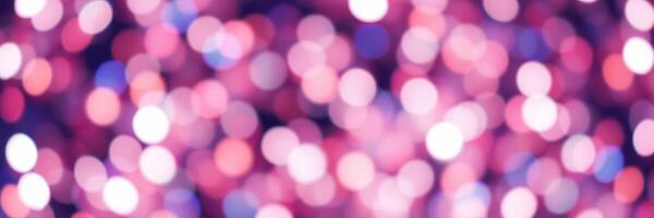 Colorful bokeh background featuring vibrant pink and purple lights in a soft focus atmosphere for creative design photo