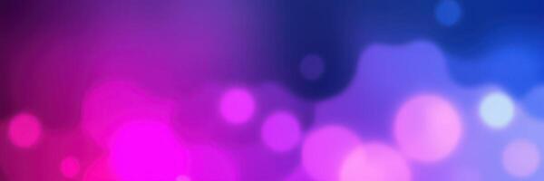 Abstract colorful background with soft glowing bokeh lights in purple and pink hues during nighttime photo