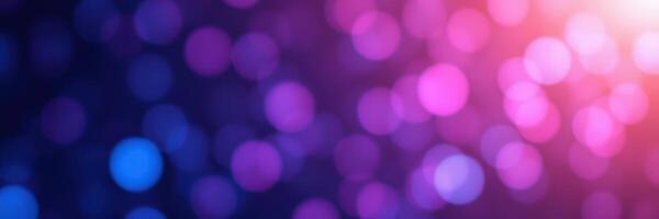 Colorful bokeh lights create a dreamy background at a nighttime event with vibrant hues of purple, blue, and pink photo