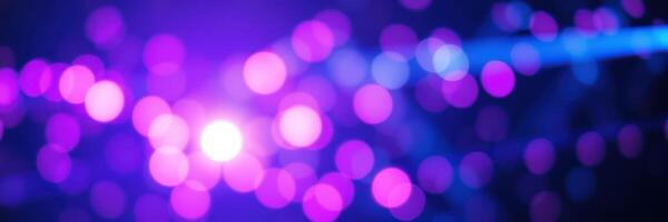 Colorful bokeh lights create a vibrant atmosphere at a nighttime event with music and celebration photo