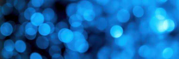 Abstract blue bokeh background created by soft light and blurred circles photo
