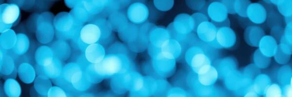 Vibrant blue bokeh lights create a captivating backdrop in an abstract display of color and texture photo