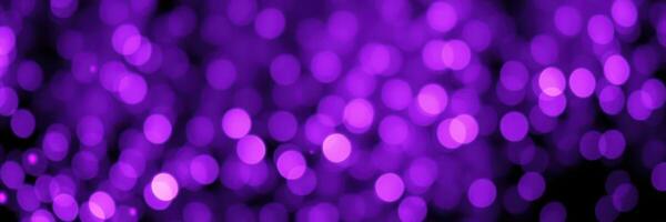 Colorful purple bokeh lights create a vibrant festive atmosphere during a special nighttime celebration photo