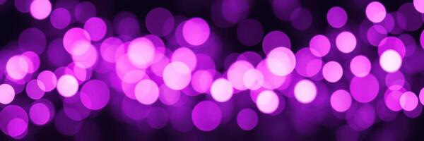Vibrant purple bokeh lights create a dreamy atmosphere for an evening event photo