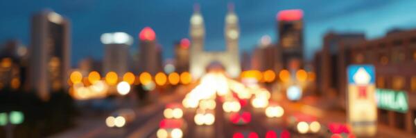 City skyline at dusk with vibrant lights and traffic flowing under a monumental arch photo