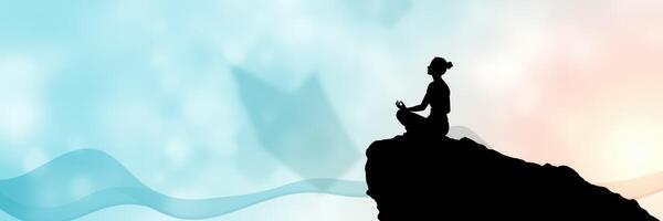 Meditation practice at sunrise on a rocky cliff with serene blue and pink background photo