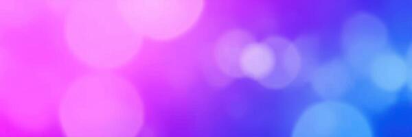 Colorful light bokeh effect with vibrant pink and blue hues during an evening event photo