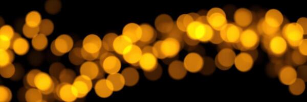 Glowing yellow bokeh lights create a warm atmosphere for celebrations during evening events in the city photo