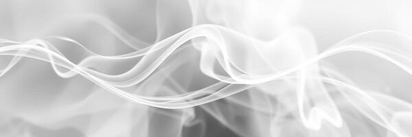 Wispy white smoke billows and floats gently against a muted background, creating an ethereal atmosphere photo