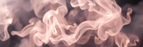 Soft wisps of translucent smoke floating gracefully in a dark background during a unique artistic display photo