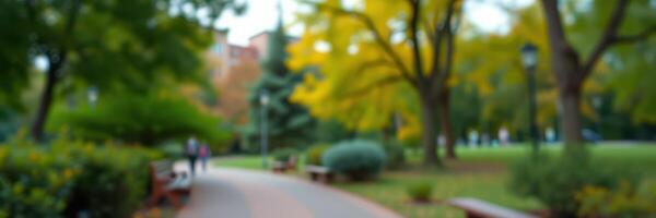 People walking along a winding path in a vibrant park during autumn with colorful foliage photo