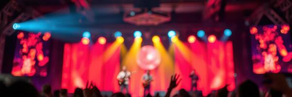 Vibrant concert featuring a lively band performing on stage with colorful lighting photo
