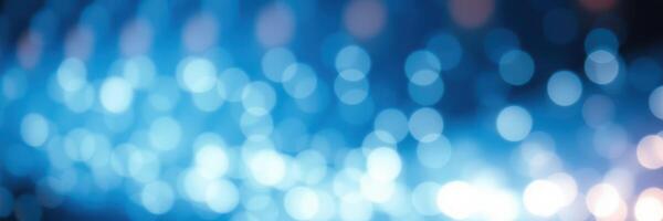 Vibrant blue abstract background with shimmering lights and bokeh effect creating a dreamy atmosphere photo
