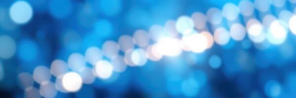 Sparkling blue bokeh lights create a festive atmosphere for celebrations during the night in a vibrant setting photo