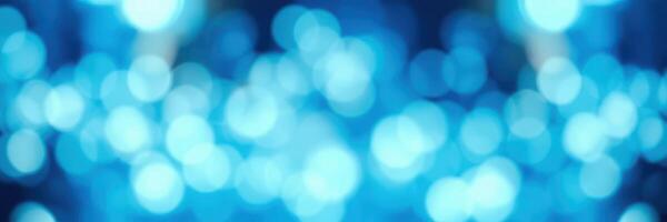 Vibrant blue bokeh lights create an enchanting atmosphere at an evening celebration photo