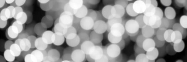 Soft bokeh lights create a dreamy atmosphere at night during a festive celebration in a city setting photo