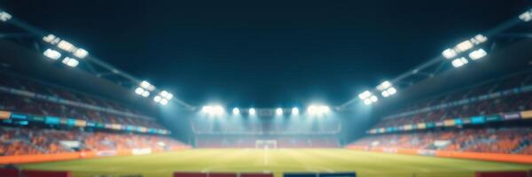Football stadium illuminated at night during a match with fans and players present photo