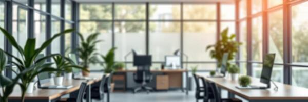 Modern office interior with large windows and greenery creating a bright and inviting workspace environment photo