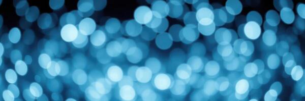 Beautiful blue bokeh lights create an enchanting atmosphere for celebrations and events at night photo
