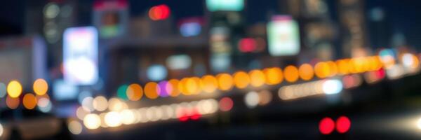 Urban nightlife illuminated by vibrant city lights and billboards creating a lively atmosphere during the evening rush hour photo
