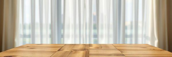 Sunlight filters through sheer curtains onto a wooden table in a modern indoor space during the day photo